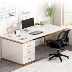 an office desk with a computer on it and a chair in front of the desk