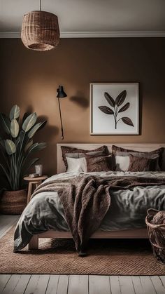 a bedroom with brown walls and wooden flooring is pictured in this image, there are two lamps hanging above the bed