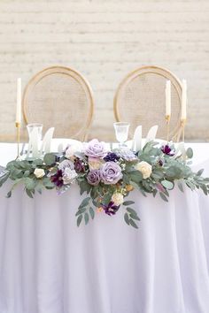 a table with flowers and candles on it for a wedding reception at kings banquet hall