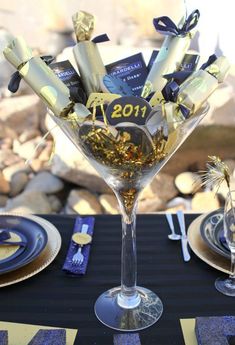 the table is set with blue and gold decorations