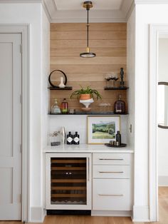 a wine cellar in the corner of a room