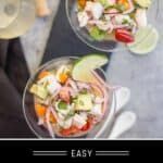 two bowls filled with salad sitting on top of a table