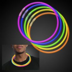 glow bracelets in various colors and sizes are shown with a man's face