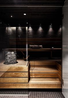 an indoor sauna with wooden steps leading up to it