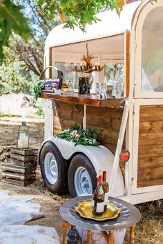 an old trailer converted into a wine cart