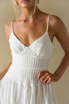 Fit for any mood, the Martina Ribbed Tie Back Mini Dress is the must-have sundress of the Summer! This fit and flare mini dress features a beachy ribbed texture, open tie back back detail, and bustier style bodice! Available in White, Green, and Black. Accessorize to complete the look! Details: 90% Polyester. 10% Spandex Lots of stretch Back zipper Back tie closure Adjustable straps Hand wash cold/ Line dry Ribbed Spaghetti Strap Summer Dress, Fitted Ribbed Mini Dress For Beach, Summer Ribbed Dress With Spaghetti Straps, Chic Ribbed Mini Dress For Summer, Summer Fitted Ribbed Mini Dress, Ribbed Fitted Mini Dress For Summer, Summer Ribbed Fitted Mini Dress, Lined Mini Dress For Beach Season, Summer Ribbed Mini Dress