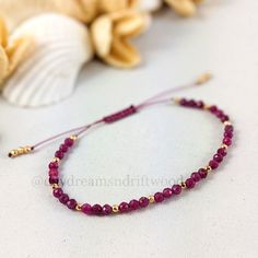 This delicate minimalist yoga bracelet is a lovely addition for the collection of any gemstone enthusiast. Ruby actively stimulates the Base Chakra, increasing vitality and chi, the life-force energy, throughout the physical body and into the spirit. It promotes a clear mind, increased concentration and motivation, and brings a sense of power to the wearer, a self-confidence and determination that overcomes timidity and propels one toward prosperity and achievement. All other gemstone bracelets Minimal Bracelet, Ruby Bracelet, Bracelets Design, Artisan Bracelets, Bracelet Minimalist, Small Bracelets, Beads Bracelet Design, Yoga Bracelet, Minimalist Bracelet