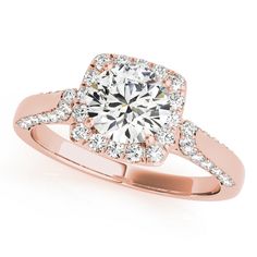 a rose gold engagement ring with diamonds on it