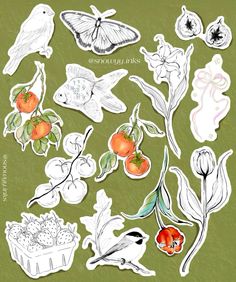 some stickers that are on top of a green surface with flowers and fruit in them