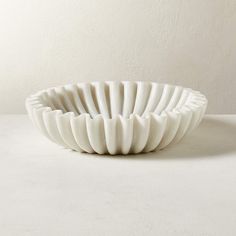 a white bowl sitting on top of a table