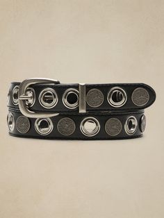 Practical luxury, this sturdy leather belt adds an extra dose of utilitarian texture with rows of shining rivets and stately coin-like accents.  Width: 1. 2" (3cm) Belts 2023, Women's Belts, Chain Belts, California Casual, Streetwear Men, Belt Design, Casual Belt, Belt Black, Streetwear Men Outfits