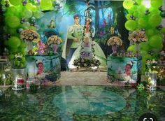 an image of a princess and the frog birthday party with balloons, flowers, and decorations