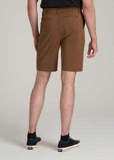 Tall Men's Shorts for the Everyday Where Function Meets Fashion Introducing our Tech Chino Shorts, a staple for the tall man's summer wardrobe. Designed with stretch fabric and a stretch waistband, these tall men's shorts offer unparalleled comfort and flexibility. The above-knee length and modern fit ensure a sleek, contemporary look, while the functional pockets add practicality. • Stretch fabric for ultimate comfort• Modern fit and above-knee length for a contemporary look• Functional pockets Functional Elastane Bottoms For Summer, Casual Brown Moisture-wicking Bottoms, 4-way Stretch Sports Pants For Summer, Scrubs Dress, Cozy Sleepwear, Tall Men, Sports Blazer, Long Sleeve Tee Shirts, Clothing Care