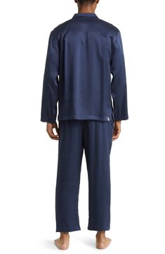 A classic button-up top pairs with matching bottoms in breathable silk pajamas that feel like a dream and can be cleaned in the washing machine. Top has front button closure; long sleeves; chest patch pocket Bottoms have elastic waist; side-seam pockets 100% silk Machine wash, dry flat Imported Casual Silk Sets With Long Sleeve, Casual Silk Long Sleeve Sets, Silk Long Sleeve Bedtime Set, Blue Silk Sleepwear For Pajama Party, Silk Sleepwear For Pajama Party, Silk Tops With Relaxed Fit For Loungewear, Casual Silk Sleepwear For Pajama Party, Silk Casual Sleepwear For Pajama Party, Casual Silk Sleepwear For Loungewear