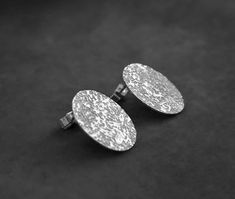 "These minimalist oval stud earrings are made by hand in sterling silver. They have been textured and polished to a shiny finish. Oval: approximately 1.4 cm ( 0.6\") x 1.8 cm ( 0.7\") Thickness: 0.7 mm The earrings are sent in a beautiful gift box. Each piece is handmade, so slight variations may exist from the item photographed. * CHECK OUT MORE JEWELLERY * www.etsy.com/shop/kailajewellery" Jewellery Minimalist, Unique Dangle Earrings, Artistic Earrings, Metal Forming, Oval Stud Earrings, Stud Earrings Silver, Oval Earrings, Oval Earring, Sterling Silver Dangle Earrings