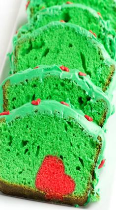 there is a green cake with red dots on it and the words grinch cake recipe