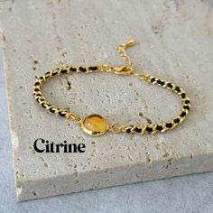 -Citrine Bracelet - Simple Elegance- The Citrine Bracelet, perfect for gifting to friends, mothers, and sisters on their special days. -High-Quality Citrine- This bracelet features a high-grade natural citrine gemstone, known for its warm yellow color. Each stone is carefully selected for its beautiful hue and smooth finish. -Elevated Design- Complementing the aquamarine is our premium curb chain, chosen for its durability and timeless appeal. A cord is skillfully woven through each chain link, adding a unique texture and a hint of artisan craftsmanship that elevates the bracelet to a luxury piece. -Item Specifications- Crystal: appox. 8mm Chain size: 3mm Material: Gold filled/White Gold Filled -The Ideal Gift- Whether for a birthday, a special occasion, or just because, this bracelet is a Adjustable Citrine Bracelets, Adjustable Gold Citrine Crystal Bracelet, Adjustable Gold Citrine Bracelet, Gold Citrine Beaded Bracelets As Gift, Citrine Crystal Bracelet Gift, Citrine Gemstone Bracelet As A Gift, Yellow Citrine Crystal Bracelet Gift, Amber Citrine Crystal Bracelet As A Gift, Amber Citrine Crystal Bracelet For Gift