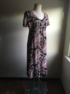 "1990s pullover dress label- Nostalgia 100% rayon, made in India black, pink, tan, green, grey floral gauze w/black slip black slip has neck line embroidered detail flutter sleeves button upfront from below waist to neck high waist line adjustable side cinch straps shoulder pads (could be removed) skirt hem has ruffle tier panels beautiful details to this dress good vintage condition, light wear label size M (see below) measures, lying flat, shoulder-18\" sleeve-6\" chest-19\" waist-17\" hip- fr Fitted Short Sleeve Patterned Maxi Dress, Casual Rayon Maxi Dress With Flutter Sleeves, Fitted Patterned Maxi Dress With Short Sleeves, Casual Flowy Empire Waist Maxi Dress, Casual Fitted Patterned Maxi Dress, Short Sleeve Rayon Maxi Dress With Ruffles, Fitted Short Sleeve Maxi Dress With Ruffle Hem, Fitted Viscose Dress With Ruffle Hem, Casual Fitted Maxi Dress With Empire Waist