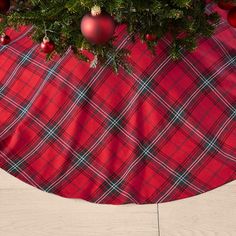 a plaid table cloth with ornaments on it