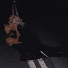 a woman is laying on the ground with her legs spread out in front of her