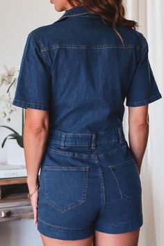 Take your denim wardrobe to the next level with The Jessie Romper! This transition-fabulous jumpsuit is the perfect pick for days when you're feeling a little bit wild, a little bit casual, and a little bit denim-y. 75% Cotton 22% Polyester 3% Spandex Color: Dark blue denim Deep V Romper No bust closure Button Zipper short closure Front & Back pockets Visible Stich seams Long 1/4 sleeve Shorts Style True to size Model is wearing a size Small. She is 5'6". 135lbs. Bust: 34C Waist 26" Hips 36 Chic Denim Blue Jumpsuits And Rompers With Pockets, Denim Blue Short Sleeve Relaxed Fit Jumpsuits And Rompers, Medium Wash Denim Jumpsuit With Short Sleeve For Work, Workwear Denim Jumpsuit With Short Sleeves, Denim Blue Jumpsuits And Rompers With Pockets, Medium Wash Overalls For Day Out, Chic Medium Wash Jumpsuits And Rompers With Pockets, Trendy Short Sleeve Relaxed Denim Jumpsuit, Trendy Short Sleeve Denim Jumpsuit In Relaxed Fit