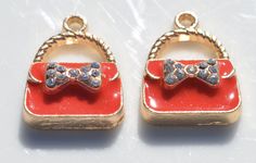 Gold Plated with Red Enamel and a Rhinestone Decorative Bow, on these cute Purse Charms. These charms are perfect to use as a pendant, zipper pull or added to a key ring or charm bracelet. 23 x 17mm, Bail opening is 2.5mm You will receive 5 Charms. SHIPPING: I do combine shipping at a flat rate in the United States, regardless of how many items you purchase. RETURNS: If you are not 100% satisfied with your purchase I will gladly issue full refund minus shipping fees. Strawberry Charm, White Purses, White Handbag, Pink Handbags, Bee Charms, Handbag Charms, Pink Purse, Cute Purses, Purse Charms