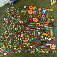 a pile of assorted bracelets and necklaces on the floor in a room