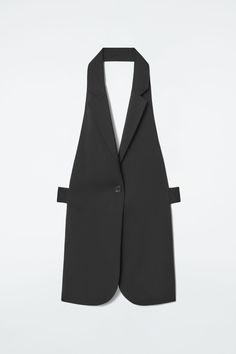 Redefining the codes of tailoring, the COS womenswear team have created this backless vest that commands attention. It's cut in a longline shape and has a deep V-neck that's framed by notched lapels. It's designed with a buttoned strap at the back that allows for different styling options. Regular fitButton closureNATIVA™ wool is sourced using regenerative practices that comply with animal welfare standards, land management requirements and the Responsible Wool Standard, supporting local communities while promoting improved soil health over time  Shell: 100% NATIVA™ RWS wool. Excluding trims / Dry clean Front length of size XS/S is 30.70" / Model wears a size XS/S Backless Vest, Mens Straw Hats, Wool Waistcoat, Mens Holiday, Land Management, Soil Health, Skirt Co Ord, Wool Vest, Outerwear Vest