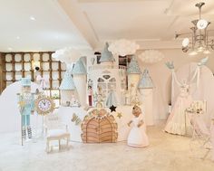 a room filled with lots of white and blue decorations on top of it's walls