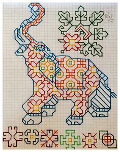 an elephant is drawn on a piece of paper with colored lines and shapes around it