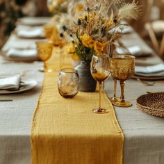 the table is set with glasses and place settings