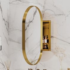 a bathroom with marble counter tops and gold accents