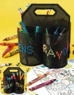 the cover of an art caddy magazine with crayons and pencils in it