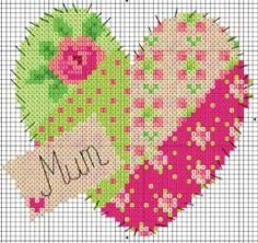 a cross stitch heart with the word mum on it's side and an image of a