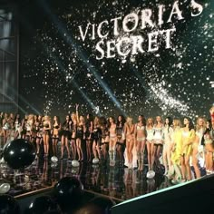 the victoria's secret contestants are on stage with balloons and confetti in front of them