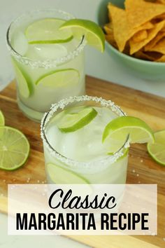 two margaritas on a cutting board with chips