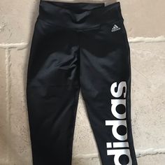 Nwt Black 3/4 Tight Mid Rise Adidas Logo On A Left Leg Waist-12 Inch Hips-13.5 Inch Length-28 Inch Fitted Adidas Activewear For Streetwear, Sporty Fitted Bottoms With Logo Print, Fitted Black Activewear With Logo Print, Adidas Black Moisture-wicking Leggings, Adidas Black Sportswear Leggings, Adidas Black Casual Leggings, Casual Black Adidas Leggings, Fitted Black Leggings With Letter Print, Black Stretch Activewear With Adidas Logo