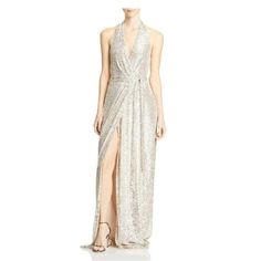 New With Tag Color: Silver Style Type: Formal Dress Material: 100% Polyester Specialty: Shimmer Size: M Closure: Tie Closure Fabric Type: Sequined Sleeve Length: Sleeveless Dress Length: Full-Length Total Length (Inches): 62 1/4 Sequins Gown, Halston Dress, Evening Wrap, Halston Heritage Dress, Cutout Gown, Halter Cocktail Dress, Sequin Halter, Dress Sleeve Styles, Surplice Neckline