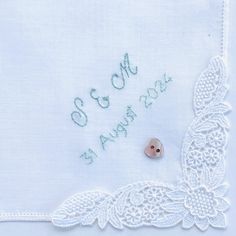 Unique new and unused hand embroidered 'the bride with date' cotton lawn handkerchief edged in one corner with pretty vintage lace.   I will use 100% colour fast embroidery thread for the inscription on this gorgeous handkerchief in a colour of your choice.  This lovely keepsake is finished off with a mother of pearl heart shaped button.   The handkerchief measures 28 cms x 28 cms.  NB: these are new, vintage lace hankies and therefore the design of the lace will differ on each handkerchief.  I Embroidered Wedding Gifts, Wedding Hankerchief, Lace Hankies, Embroidered Handkerchief Wedding, Embroidered Handkerchief, Wedding Handkerchief, Embroidered Wedding, Something Old, Bridal Gifts