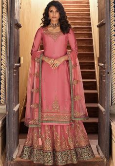 pink chinon straight embroidered lehenga style suit 15159  Desc:  Pink Chinon Straight Embroidered Lehenga Style Suit. Comes with matching Inner Shantoon and bottom Net-Shantoon with Chinon dupatta. Slight variation in color fabric and work is possible. Model images are only representative. Designs  patterns and colors may slightly vary from the actual color vs. image due to screen resolution or photography lights.Accessories and other item shown in picture is used for photography will not inclu Chinon Fabric Suit Design, Party Wear Lehenga Style, Chiffon Lehenga, Partywear Lehenga, Long Choli Lehenga, Pakistani Lehenga, Net Skirt, Lehenga Suit, Unstitched Dress Material