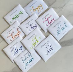 six cards with different sayings on them sitting on a marble countertop in front of a marble wall