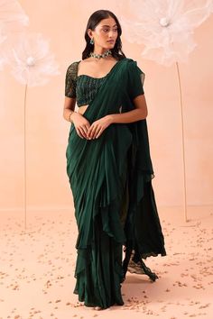 Emerald green satin crepe ruffle pre-draped saree with pleated detailing. Comes with a floral hand embroidered padded blouse. - Aza Fashions Chiffon Saree With Ruffles In Traditional Drape, Ruffled Chiffon Saree In Traditional Drape, Fitted Chiffon Saree With Ruffles, Chiffon Ruffle Blouse For Wedding, Festive Green Pre-draped Saree With Ruffles, Elegant Draped Ruffle Blouse, Elegant Draped Blouse Piece With Ruffles, Festive Green Ruffled Saree, Green Georgette Saree With Ruffles