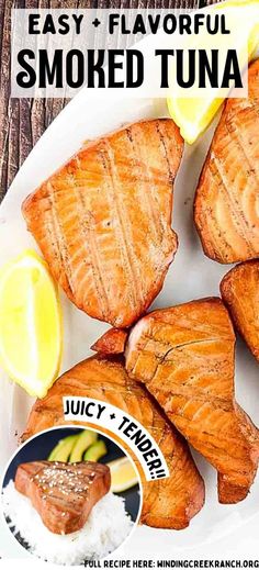 salmon fillets on a white plate with lemon wedges