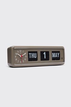 an alarm clock with the words thu, thu and 1 may on it