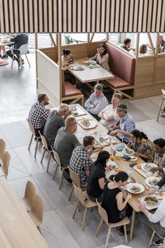 an overhead view of people eating in a restaurant