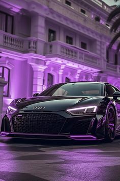 a black and purple sports car parked in front of a building