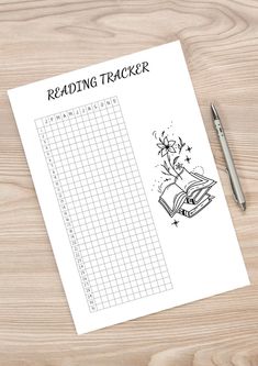 the reading tracker is next to a pen