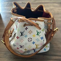 Louis Vuitton Multicolor Petite Noe Bucket Bag Blanc. Good Condition. The Vachetta Leather Is A Beautiful, Golden Patina. Measurements: 9” (L) X 7” (W) X 11” (H) Shoulder Strap Length: 28.7-32.2” Adjustable Gold Tone Hardware. Luggage Tag. 2 Pockets On Both Sides Of Bag. Designer Multicolor Monogram Canvas Bag, Daily Use Multicolor Monogram Canvas Bag, Luxury Multicolor Everyday Bags, Luxury Multicolor Bags With Original Box, Luxury Multicolor Rectangular Bucket Bag, Luxury Multicolor Bucket Bag With Removable Pouch, Designer White Leather Bucket Bag, White Monogram Canvas Shoulder Bag, Everyday White Monogram Canvas Shoulder Bag