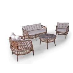 three wicker couches and two chairs with cushions