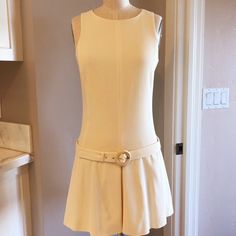 Prada Ivory Sleeveless Open-Back Belted Waist Dress Made In Italy Size 42 / Size 6 Us Dry Clean Only Bust 32" Waist 28" Hips 34" Fabric Unknown But Definitely Has Some Stretch To It. Sleeveless Beige Mini Dress For Daywear, Beige Sleeveless Mini Dress For Daywear, Classic Sleeveless Mini Dress For Daywear, Cream Sleeveless Fitted Mini Dress, Cream Sleeveless Mini Dress For Work, 60s Clothing, Prada Dresses, Waist Dress, Dress Making